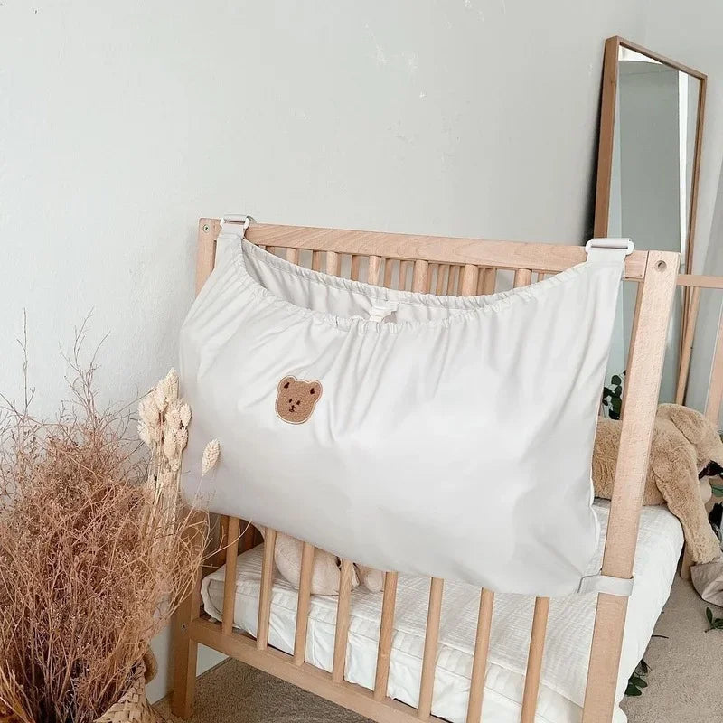 Organisateur Suspendu Bébé – Sac de Rangement Couches & Jouets pour Lit ou Poussette